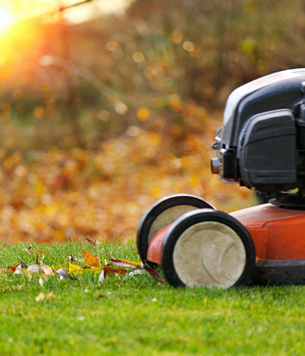 Lawn mower in the garden with beautiful sunset in the background in Morris, NJ